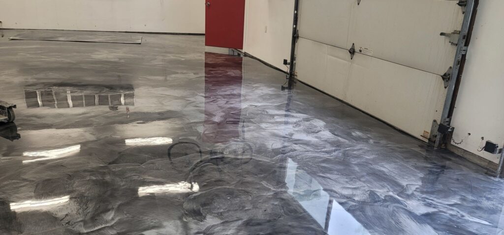 Professional installation of a seamless epoxy flooring geelong system inside a residential garage