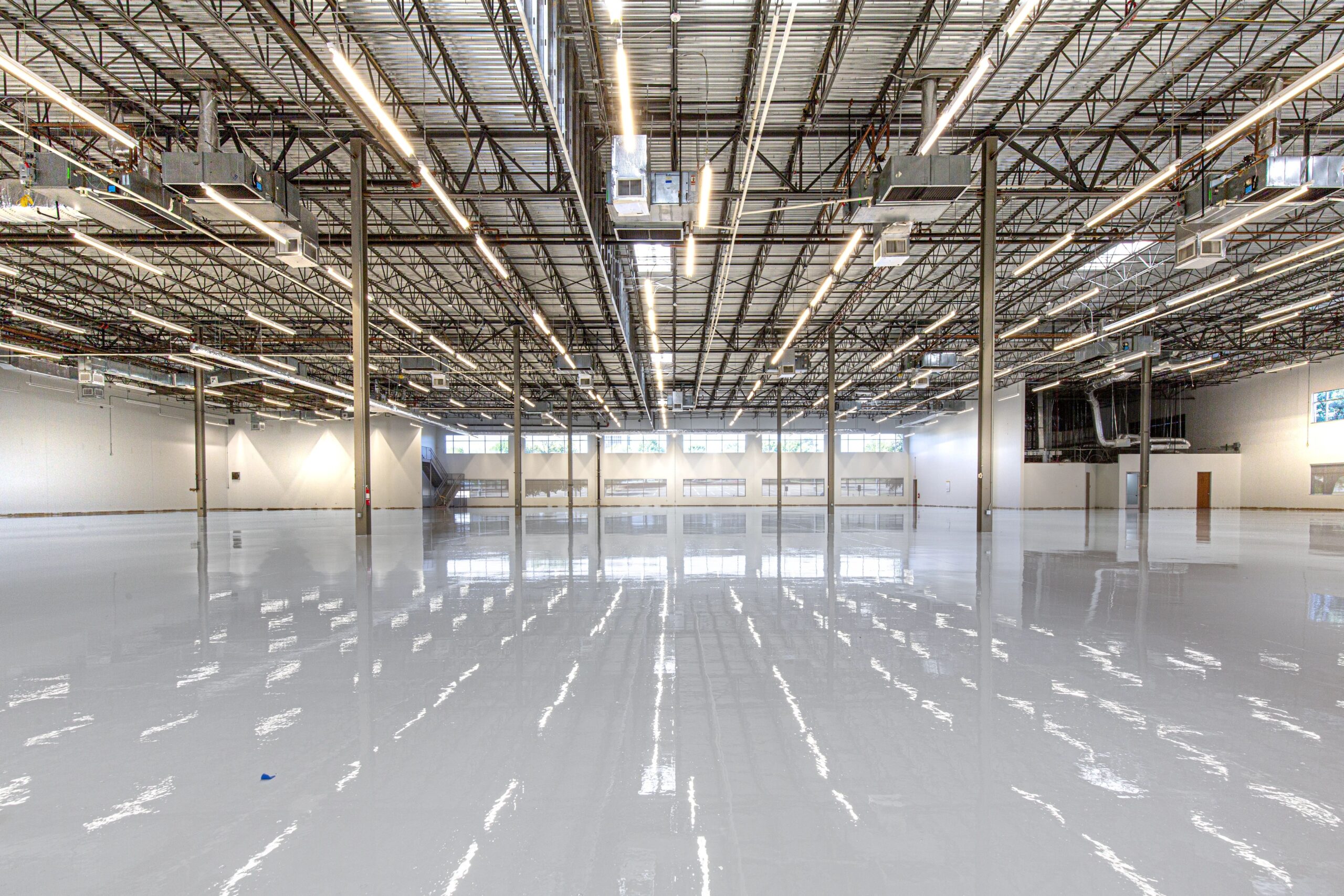 Glossy epoxy flake flooring finish in industrial facility