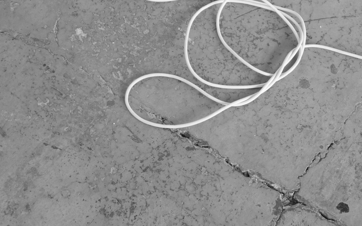Cracked worn concrete floor before coating